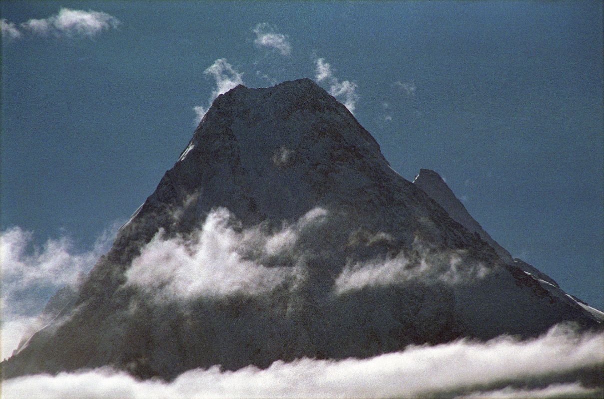 24 Gasherbrum IV and Gasherbrum II Close Up From Goro II Early Morning The sun shines over the top of Gasherbrum IV (7925m) with Gasherbrum II peaking out to its right, seen in the early morning from Goro II.